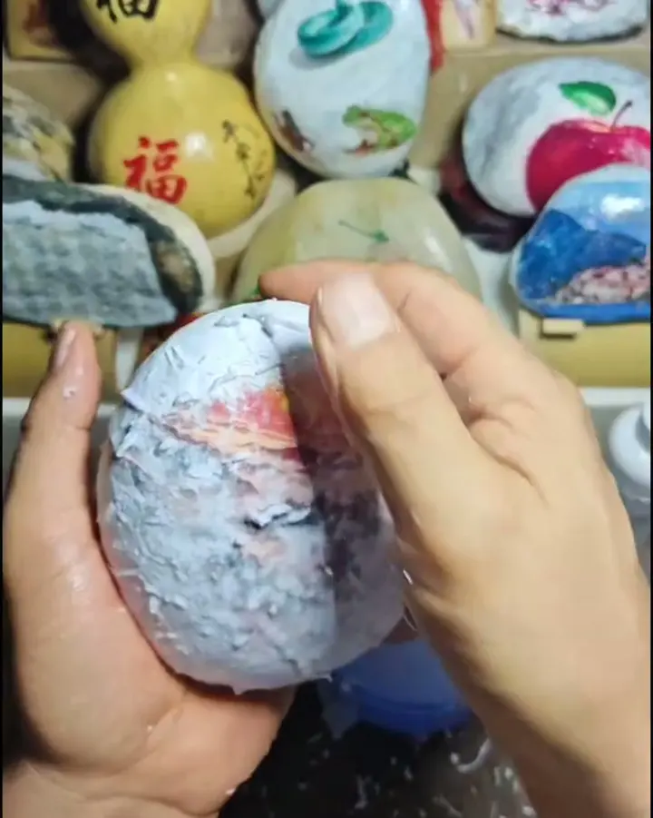 The picture appearing on the stone as the paper comes off
