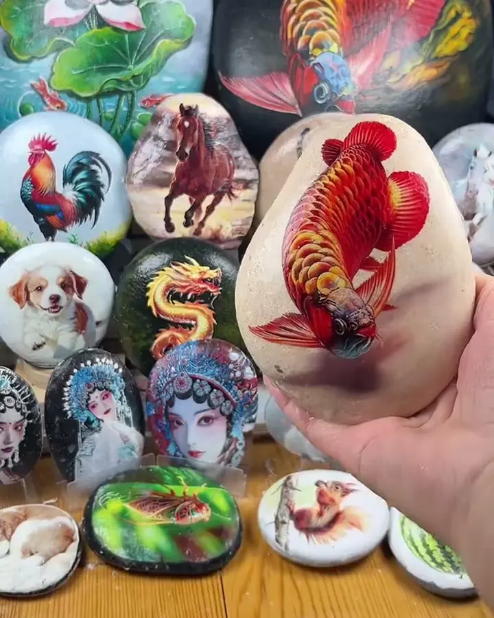 A finished stone with a red fish design